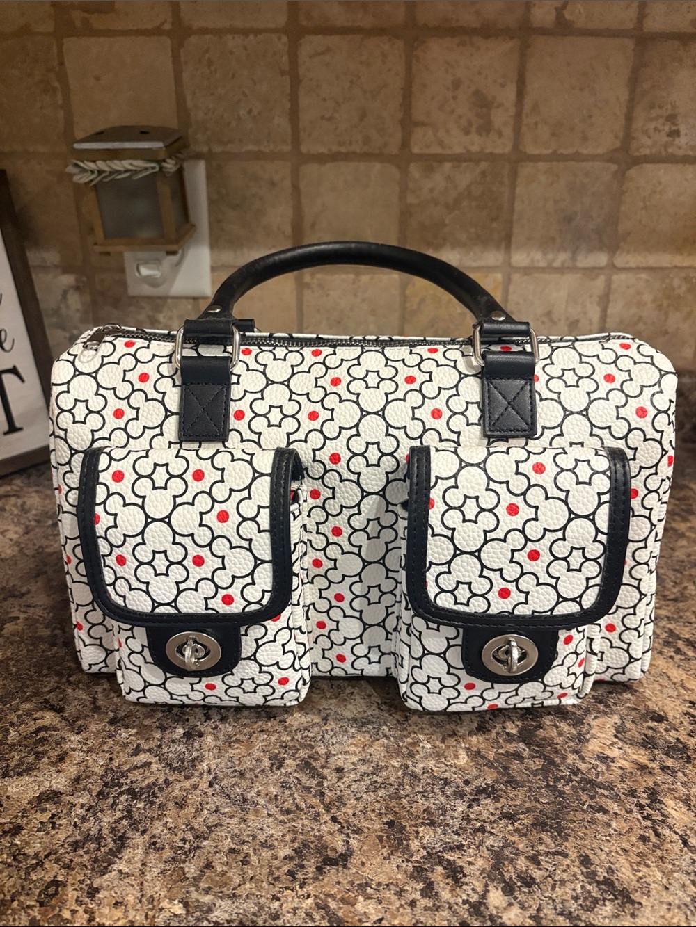 Stylish Black & White Floral Print Men’s Carry Bag with Red Accent